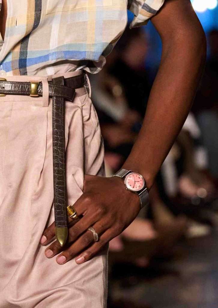 Luxury watch styled on a man's smaller wrist for a refined look