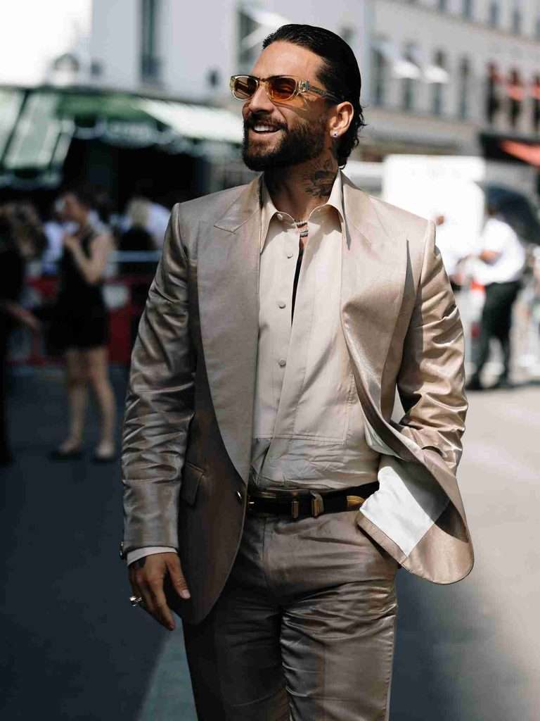 Man wearing refined jewellery and accessories to complement his personal style